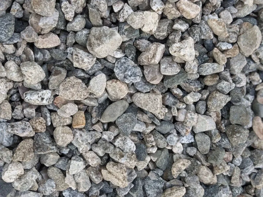 Pile of gray crushed stone aggregate